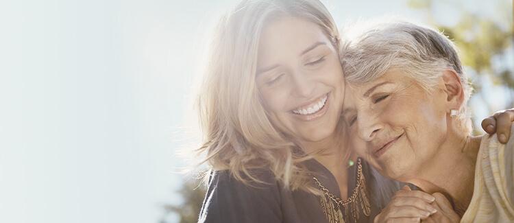 Daughter hugging mother