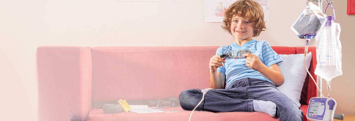 Boy playing with Playstation