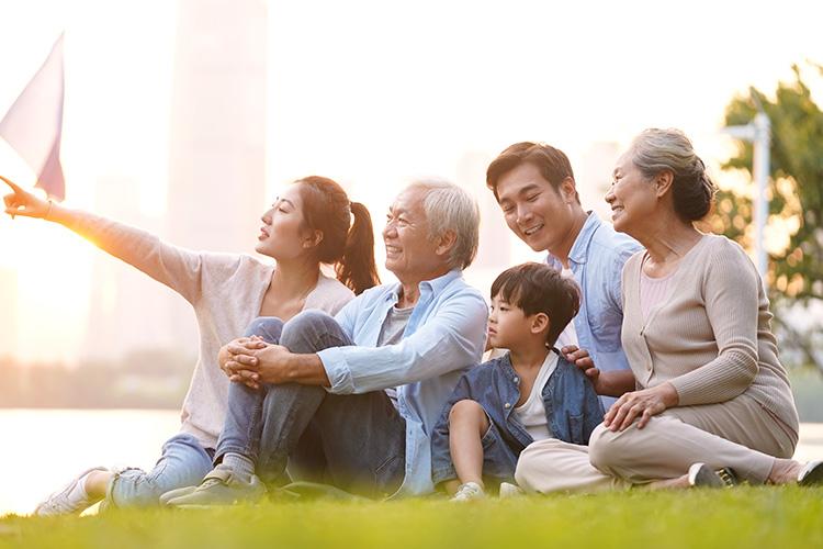 family sitting in the park