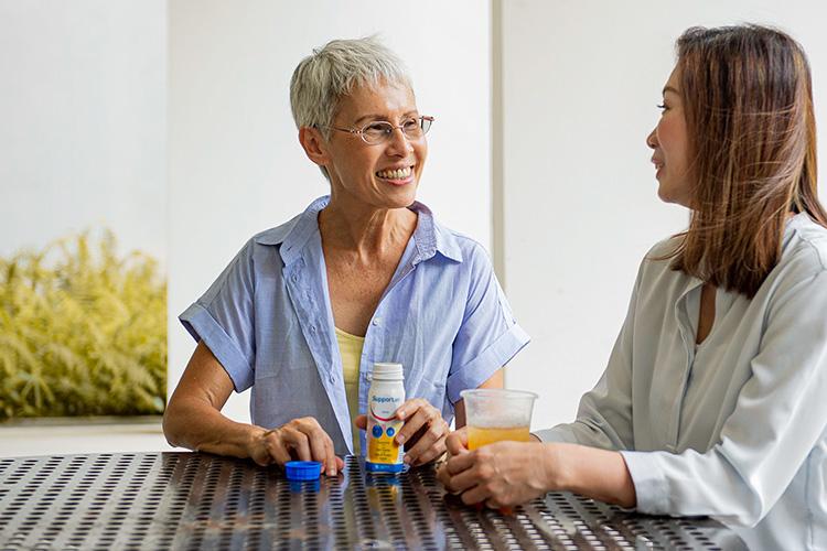 two woman chatting with each other